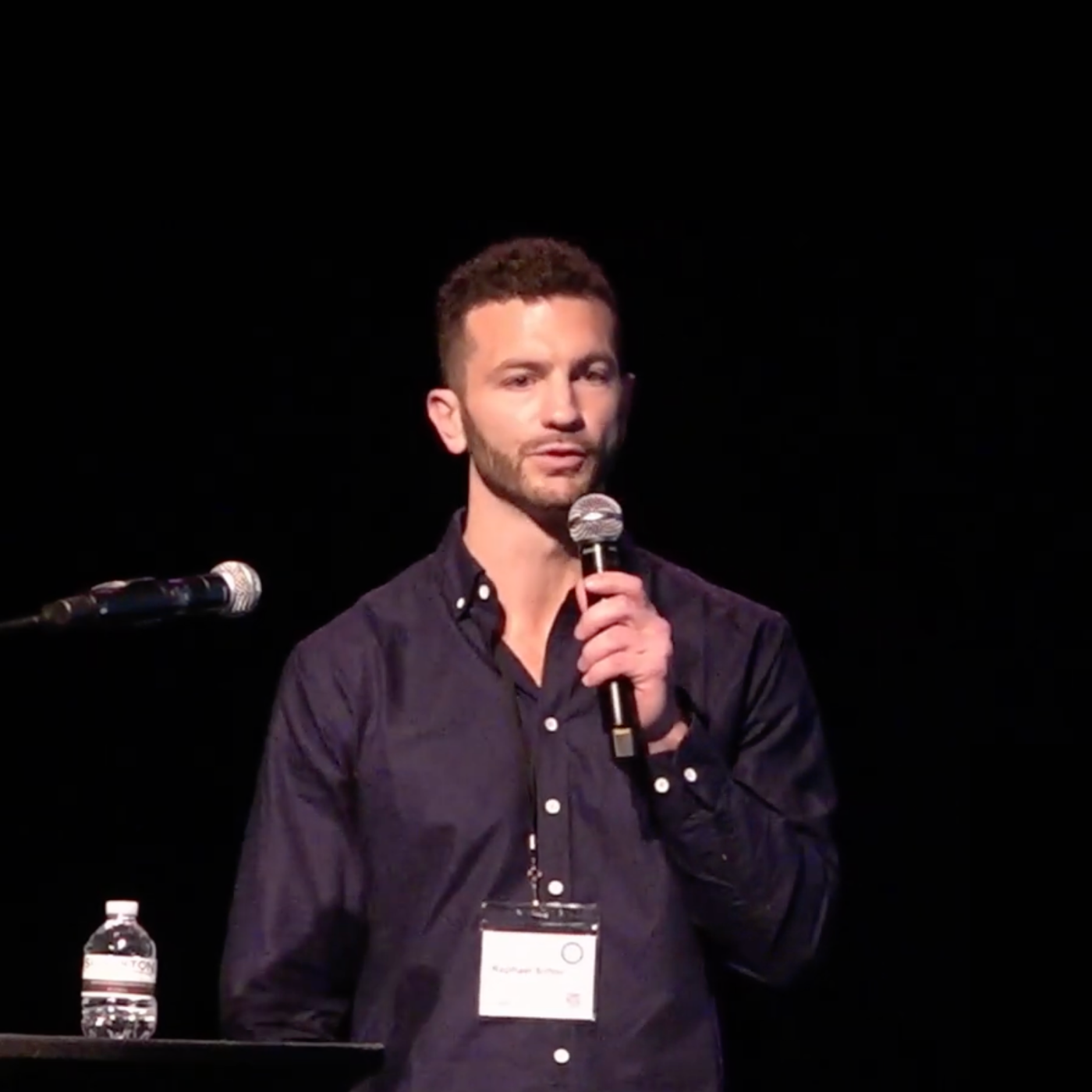 Raphael Sirtoli speaking on stage at the CoSci Conference 2024