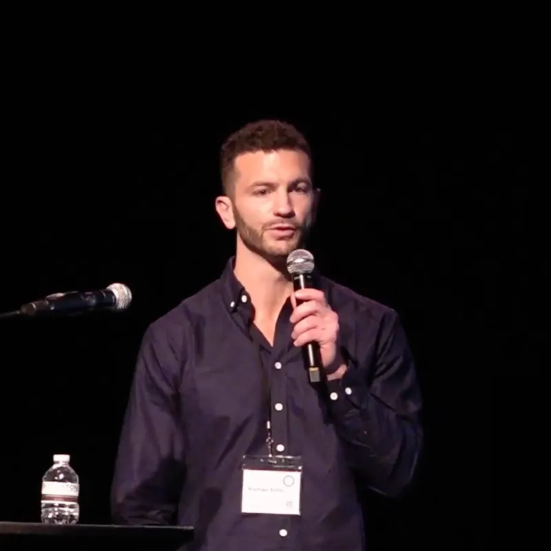 Raphael Sirtoli speaking on stage at the CoSci Conference 2024